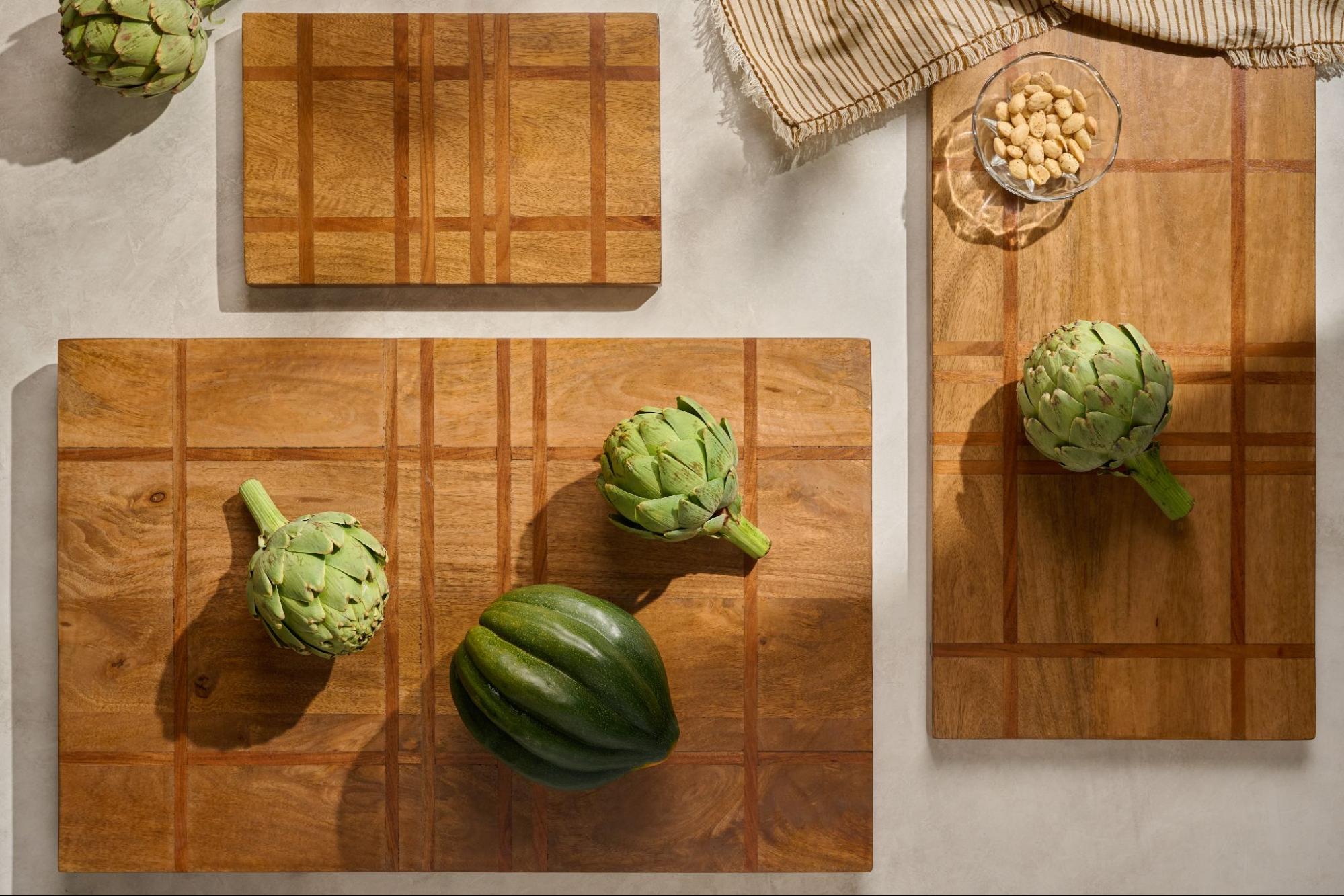 Wooden cutting boards with green vegetables