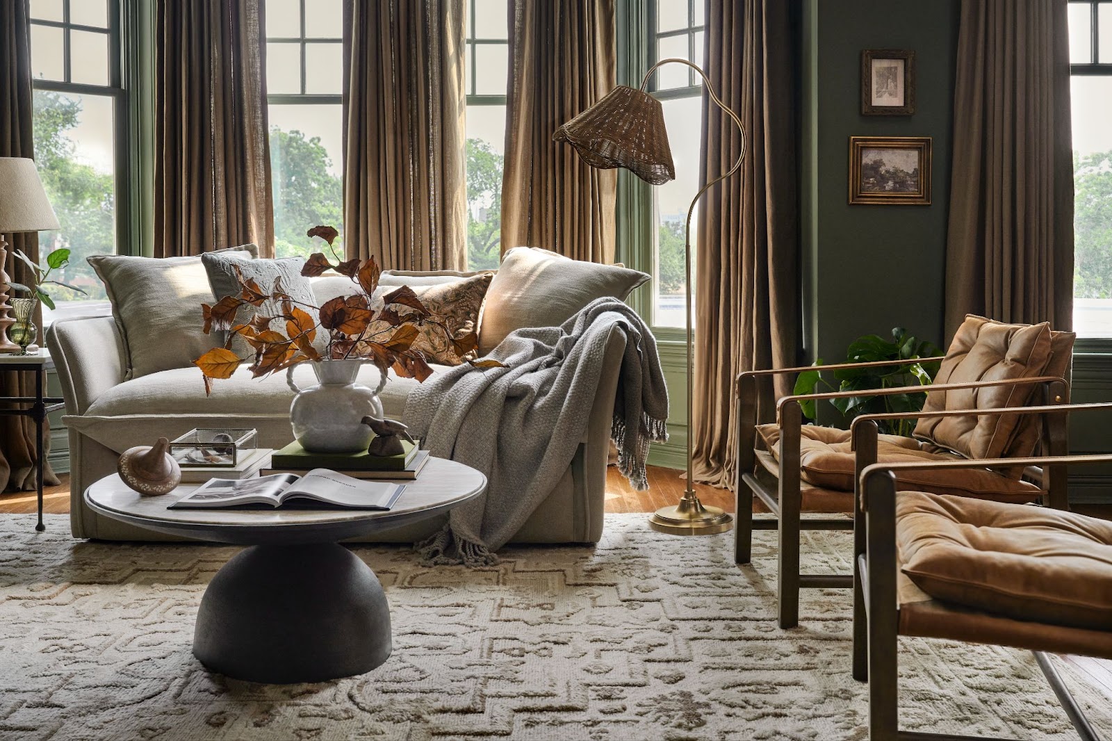 A living room scene features furniture and fall decor from Magnolia. 