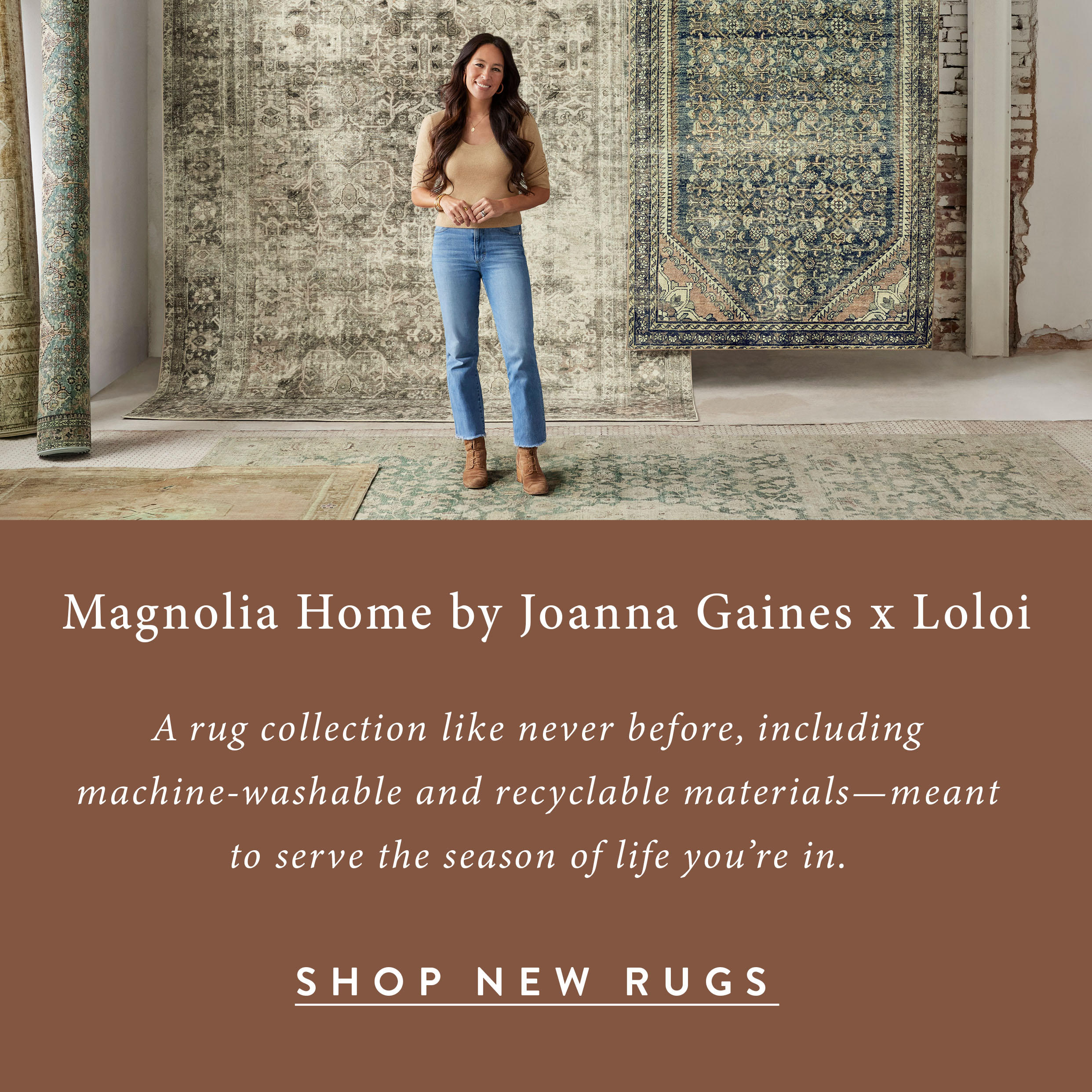 Magnolia Home Rugs by Joanna Gaines x Loloi. Joanna gaines stands in front of rugs hanging on walls