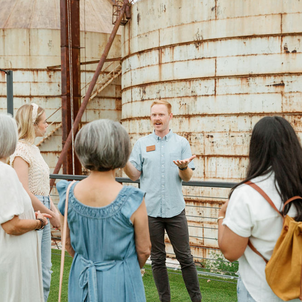 Group standing on rooftop learning about the Silos.