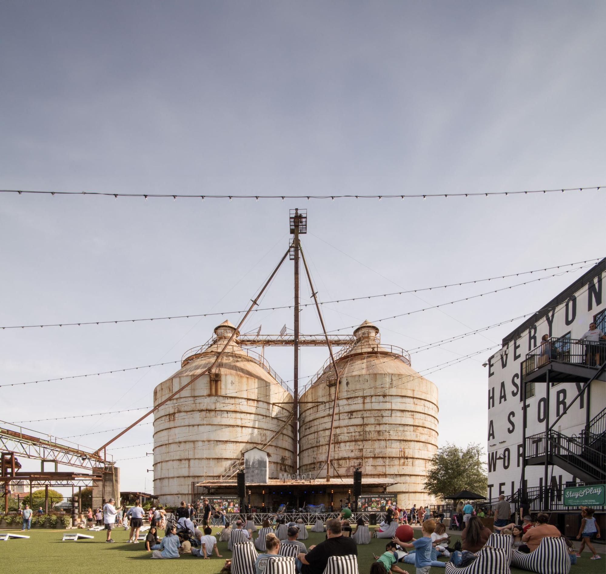 People sitting in beanbag chairs in front of Silos